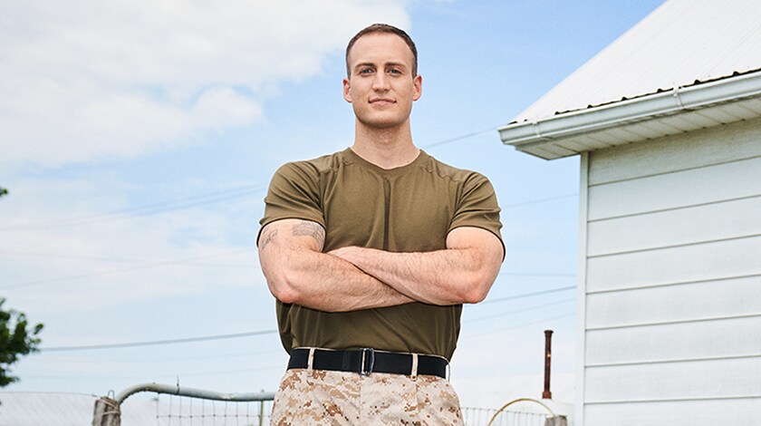 Military man outside of his house.