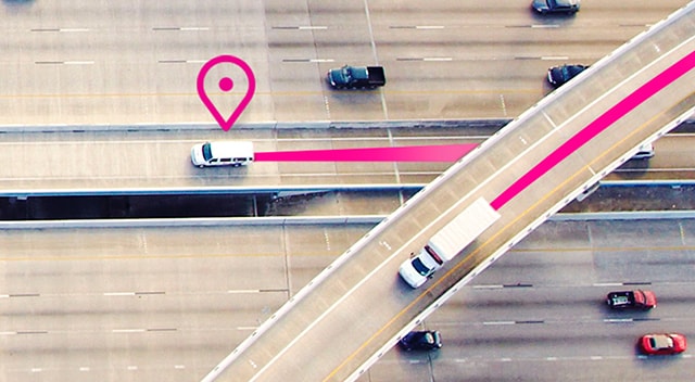 An overhead view of business vehicles in transit.