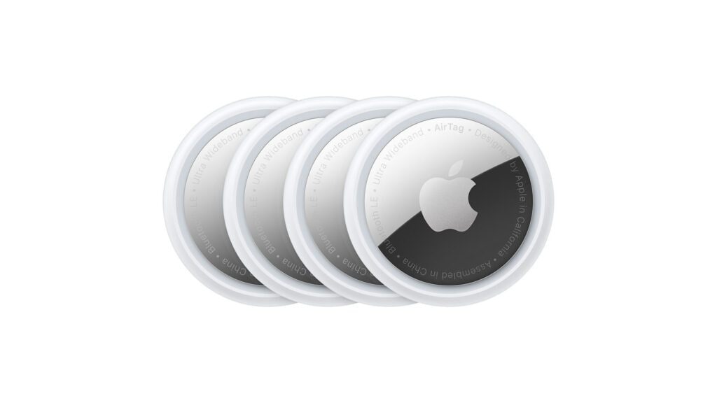 Image of four Apple Air-Pods against a white background.