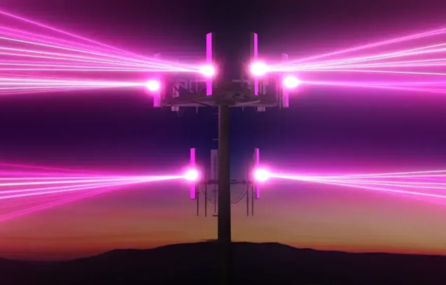 Top of a cell phone tower with beams of magenta light shooting out from six signal emitters.