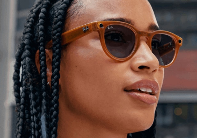 Close up of a person wearing Ray-Ban smart glasses.