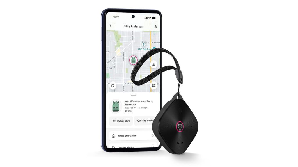 Image of a SyncUp Tracker 2 and a phone against a white background.
