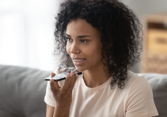 woman-speaking-into-phone