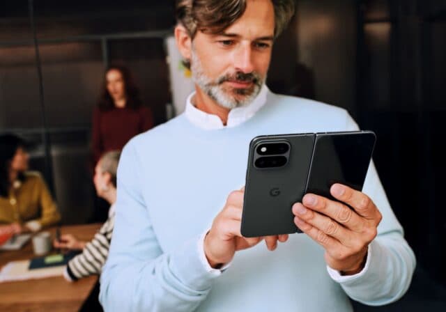Man-using-Google-Pixel-smartphone-in-kitchen