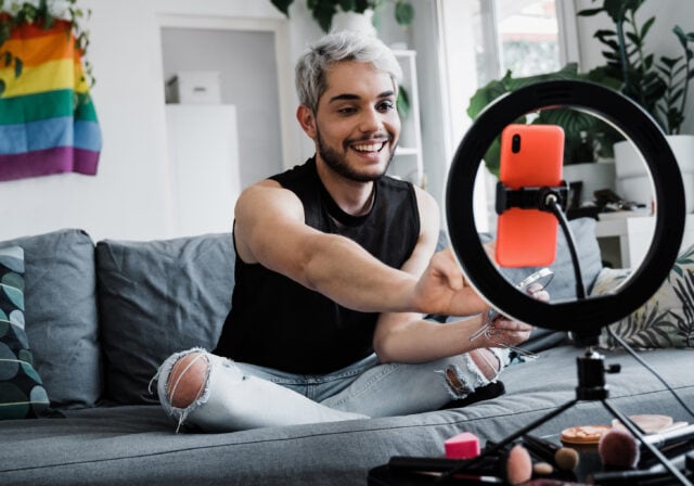 Content-creator-streaming-makeup-tutorial-on-phone
