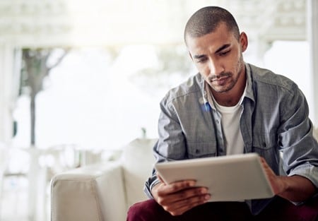 Person browsing tablet using 5G internet