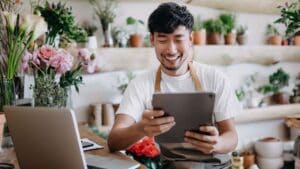 A florist using a tablet.