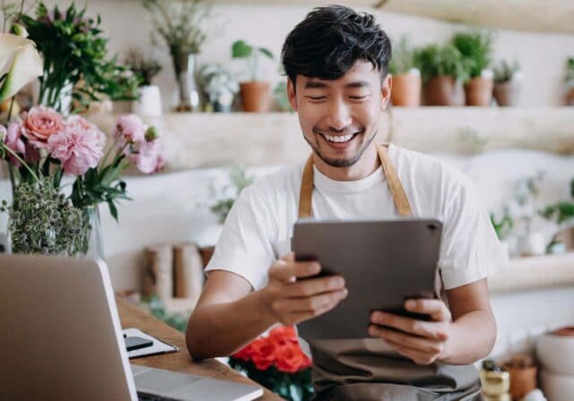 A florist using a tablet.