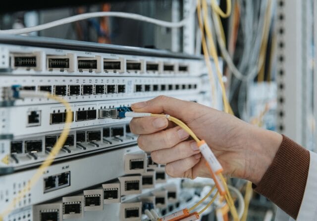 plugging-in-fiber-optic-cable-data-center