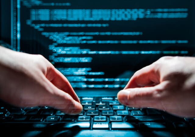 Hacker-using-laptop-to-hack-wi-fi