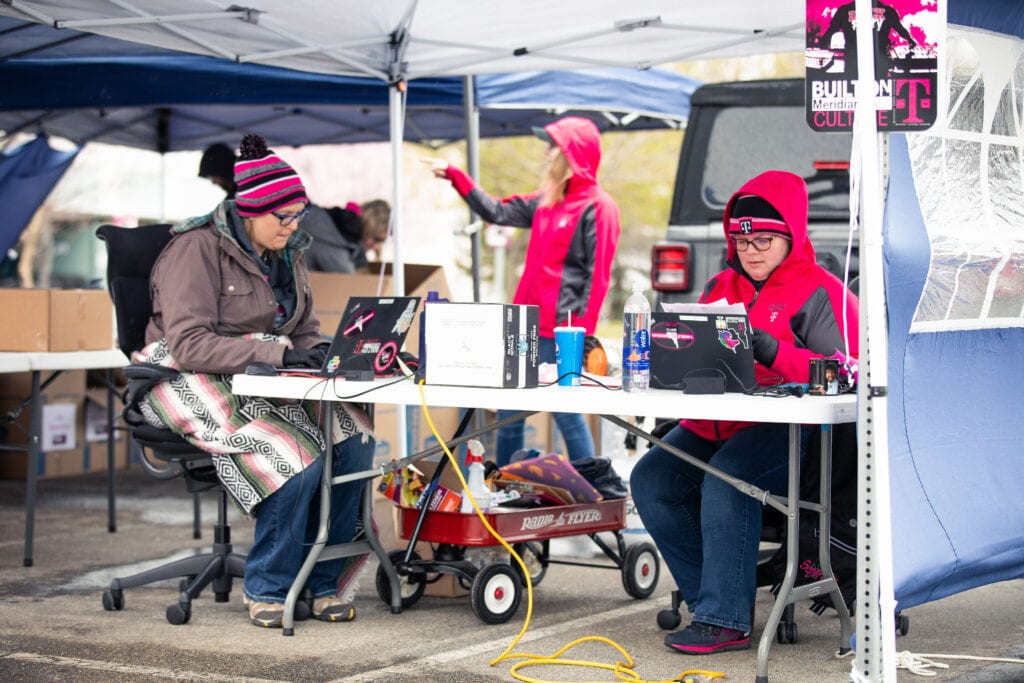 T-Mobile employees in Boise, Idaho organized curbside technology pickup so customer care teams can work from home during COVID-19 pandemic.