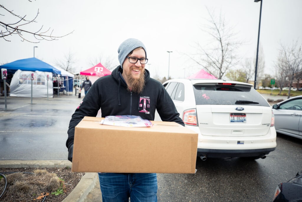 T-Mobile employees in Boise, Idaho organized curbside technology pickup so customer care teams can work from home during COVID-19 pandemic.
