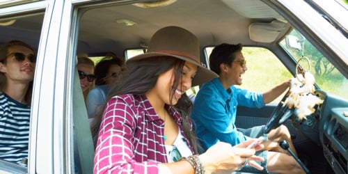 travelers in car getting ready for summer