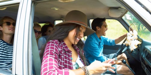 travelers in car getting ready for summer