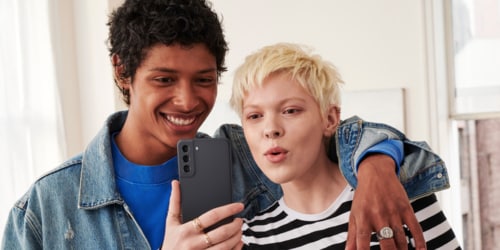 two people looking at a phone