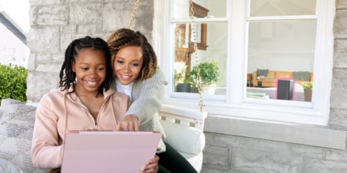 mother and daughter on computer