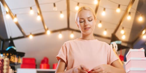 Tech gifts for men - Woman wrapping gifts