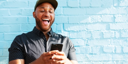 happy man looking at his phone