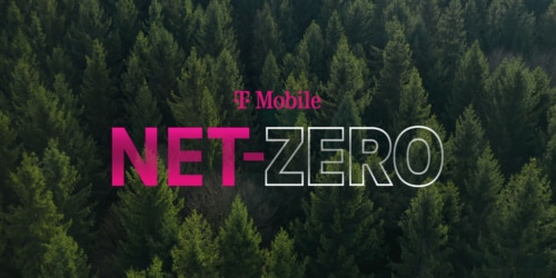 Aerial view of evergreen trees with magenta T-Mobile logo and Net Zero logo