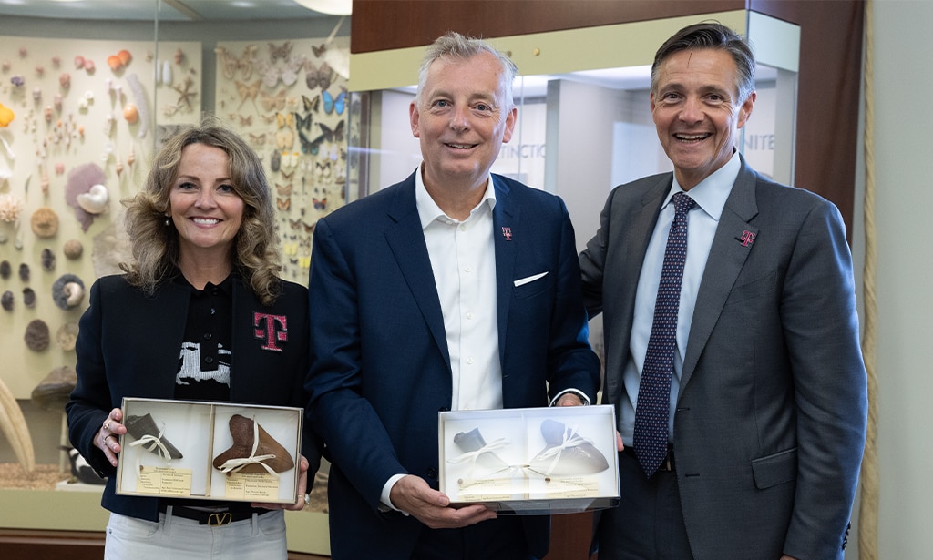 Photo of T-Mobile executives at Smithsonian exhibit.