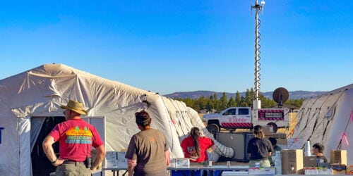 T-Mobile Emergency Management vehicle providing satellite coverage to an operations camp of first responders