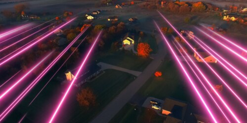 graphic image of magenta streaks over homes