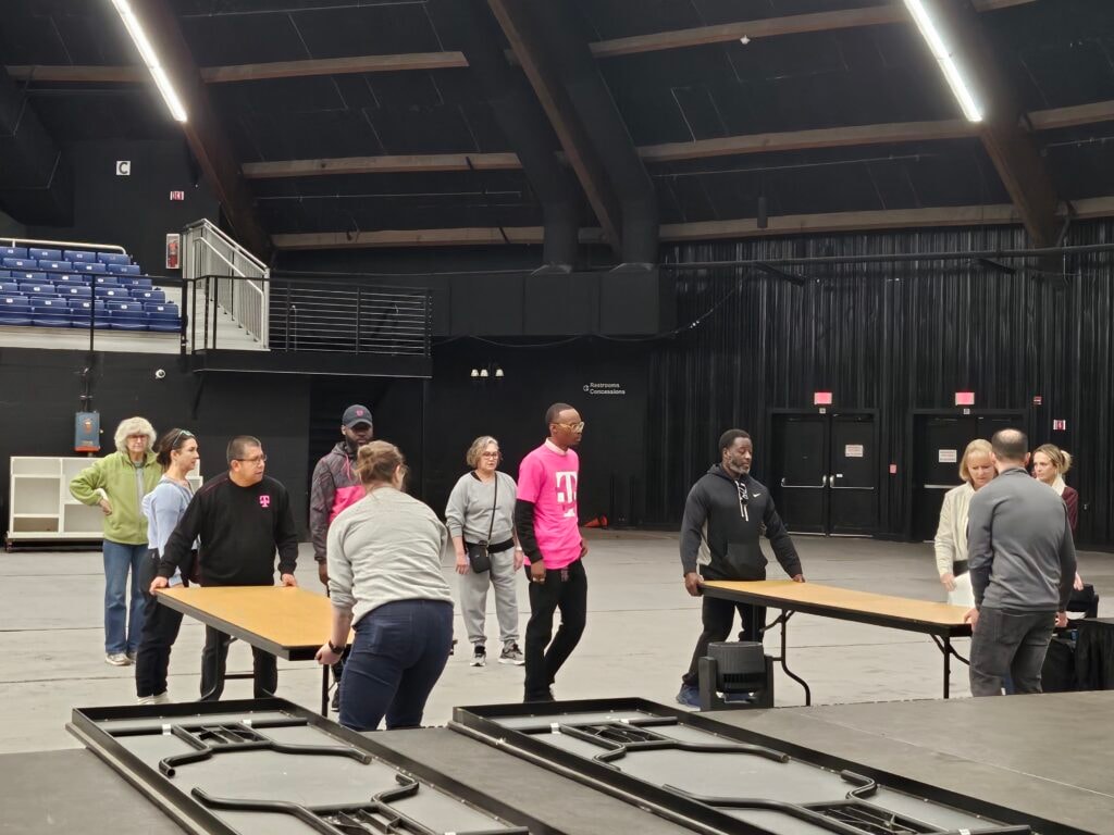 CEC Rochester employees volunteering to set up Center For Youth's biggest fundraiser event.
