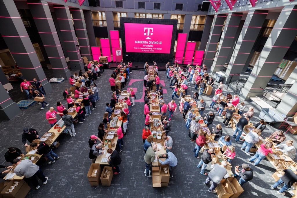 Employees at T-Mobile’s Overland Park headquarters pack 10,000 meals for Harvesters