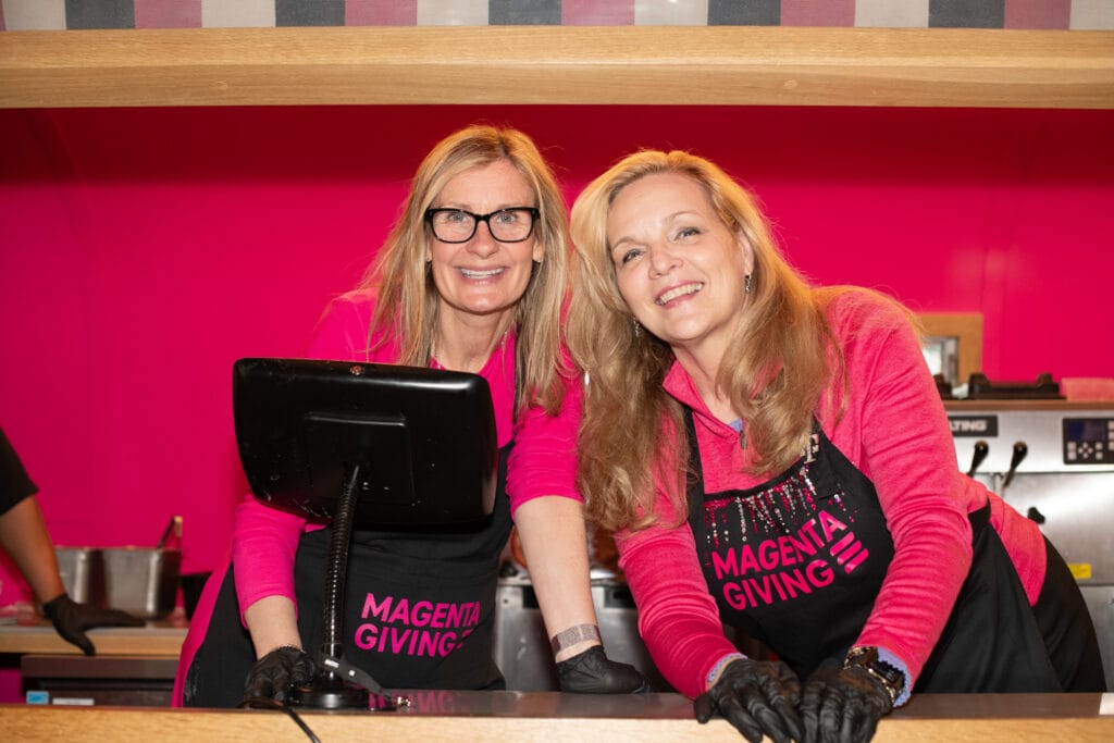 Susan Loehndorf, SVP of Employee Brand & Communications, and Janice Kapner, EVP & Chief Communications and Brand Officer, serve up sweet treats and sweeter vibes at the Froyo for Good 