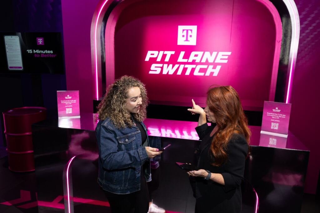On Nov. 20, 2025, T-Mobile guests mingle at the ARIA Resort and Casino, while experiencing the company's new AI-powered Easy Switch tool following a news event during the Formula 1 Las Vegas Grand Prix. (Brian Friedman/AP Content Services for T-Mobile)