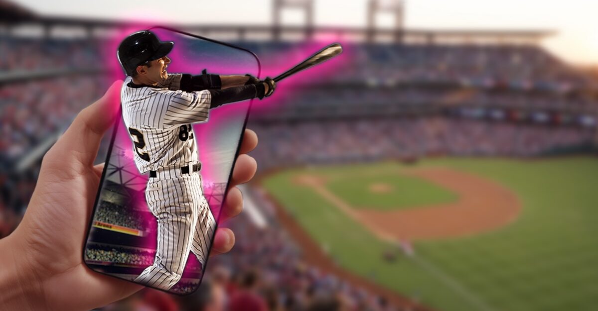 baseball fan holds phone with 3D image of baseball player