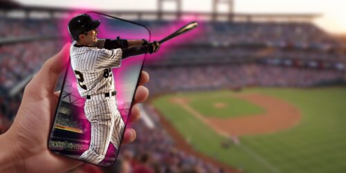 baseball fan holds phone with 3D image of baseball player
