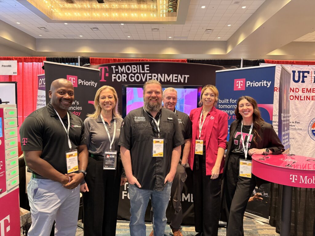 T-Mobile emergency response team members connecting with peers at the conference.